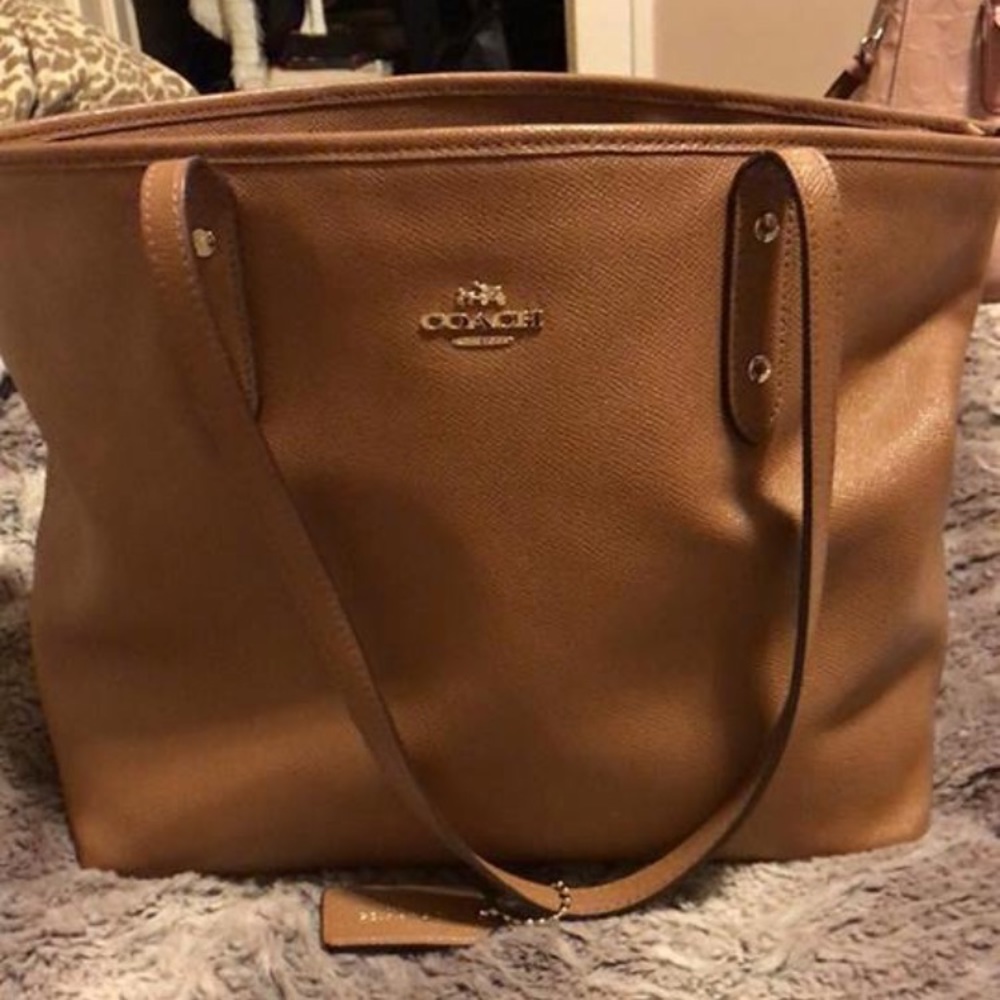 Coach purse, HP computer, L’ange wand